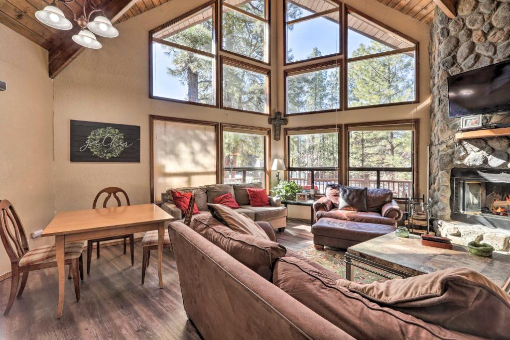 A seating area at Munds Park Cabin with Fire Pit and Wraparound Porch!