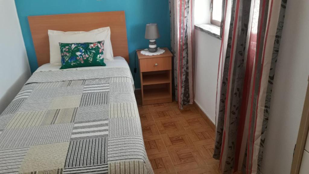 Postel nebo postele na pokoji v ubytování Vivenda João Damas