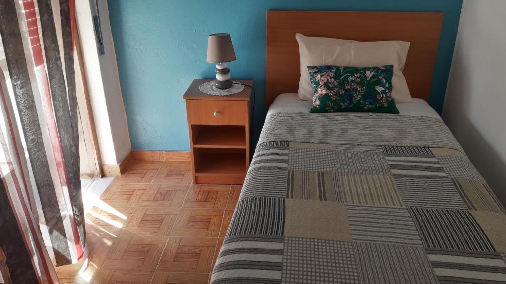 Postel nebo postele na pokoji v ubytování Vivenda João Damas