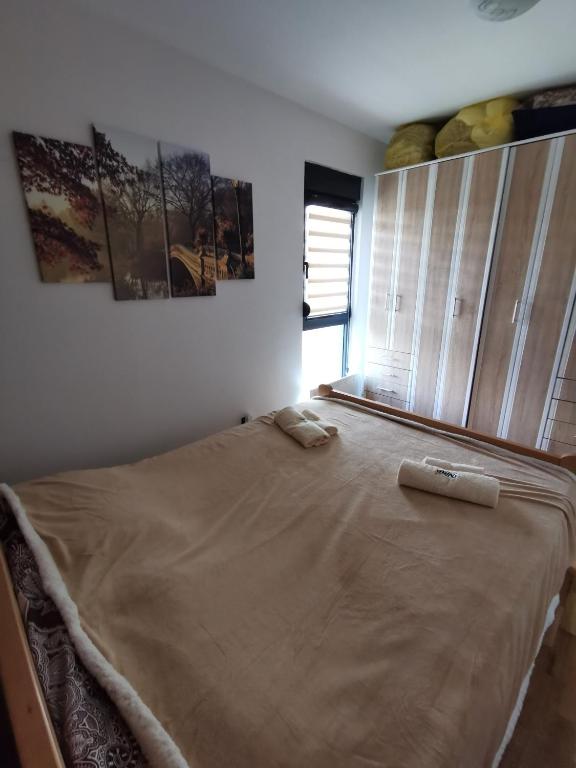 Postel nebo postele na pokoji v ubytování Apartman NINA Bombonjera