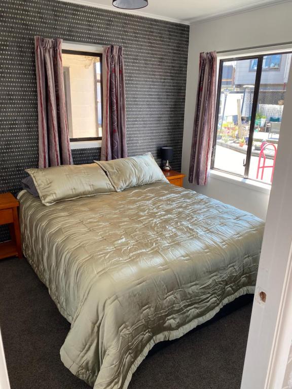 Postel nebo postele na pokoji v ubytování Windsor Motel