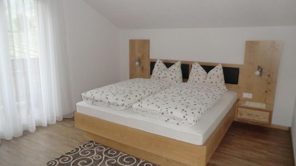 Postel nebo postele na pokoji v ubytování Garni Pircher