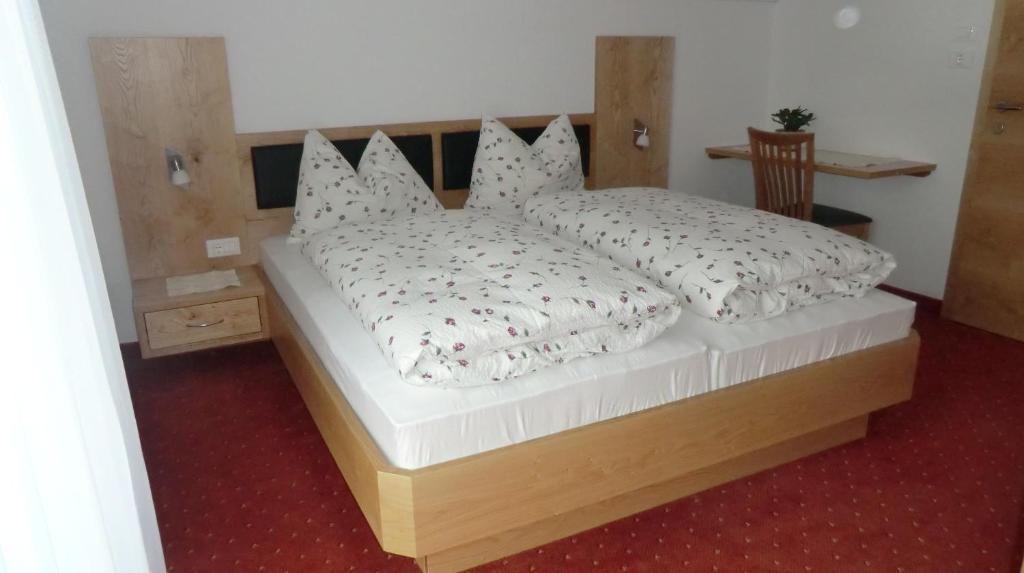 Postel nebo postele na pokoji v ubytování Garni Pircher