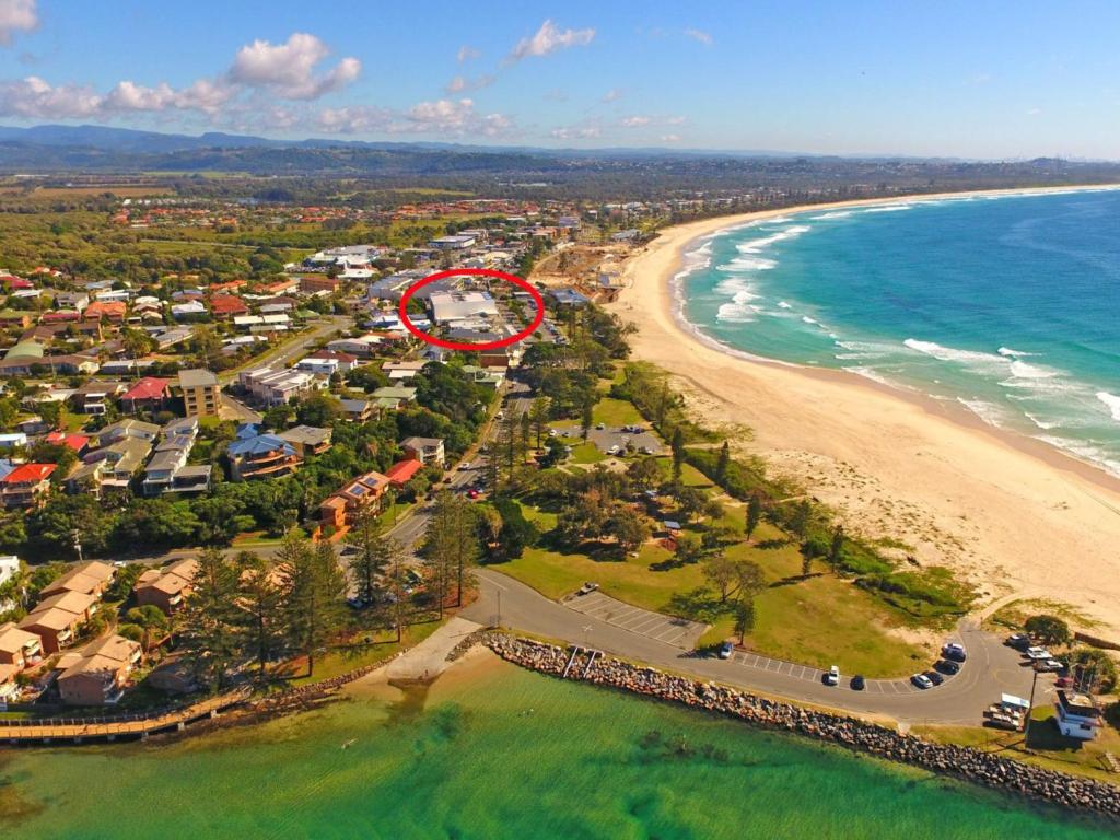 an aerial view of a resort next to the beach at Azura Ocean View Holiday Apartment in Kingscliff