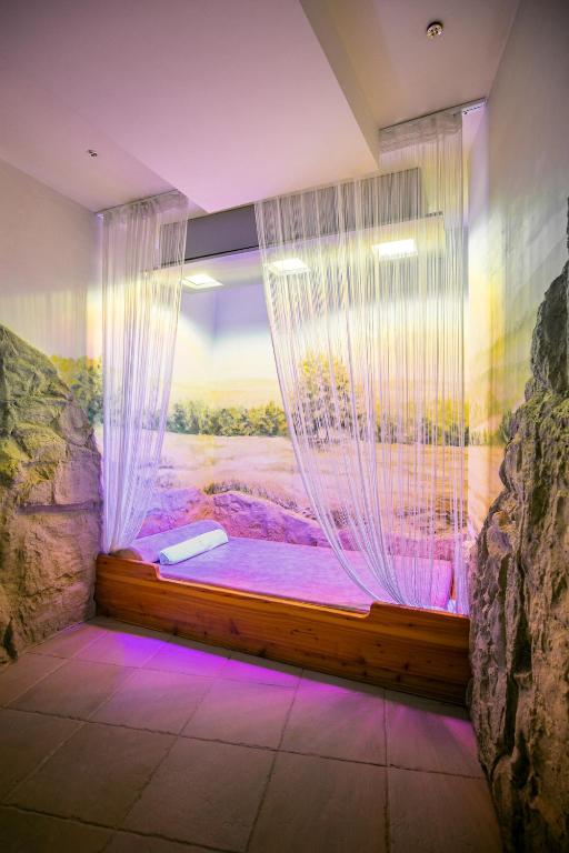 Postel nebo postele na pokoji v ubytování Trofana Wellness & SPA