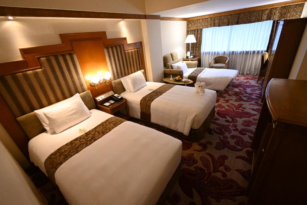 Postel nebo postele na pokoji v ubytování Hotel Sintra