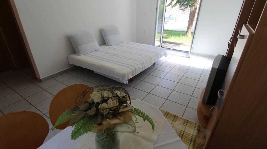 Postel nebo postele na pokoji v ubytování Apartments Grahovac