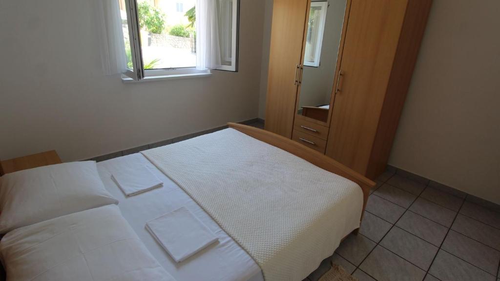 Postel nebo postele na pokoji v ubytování Apartments Grahovac