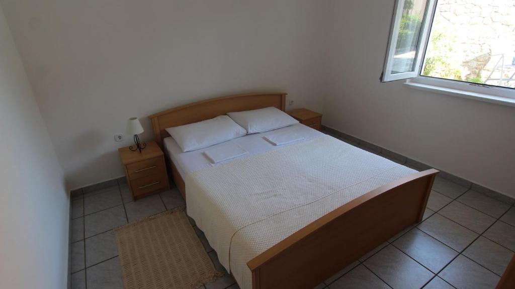 Postel nebo postele na pokoji v ubytování Apartments Grahovac