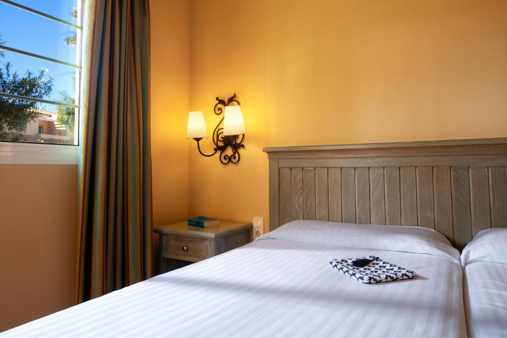 Postel nebo postele na pokoji v ubytování Royal Suite