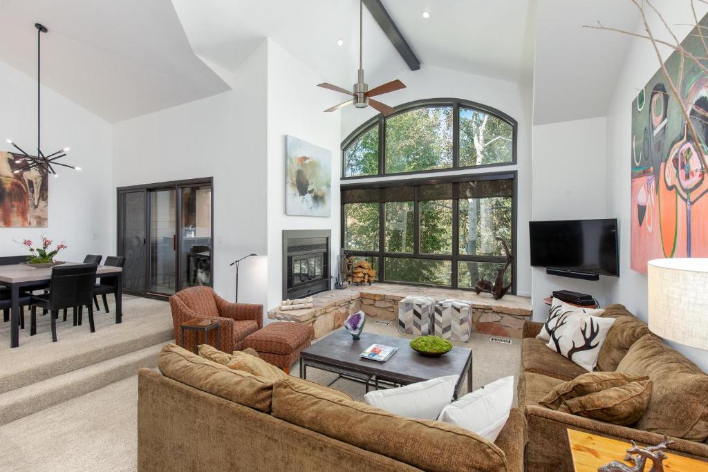 a living room with two couches and a fireplace at Stonebridge #1145 in Park City