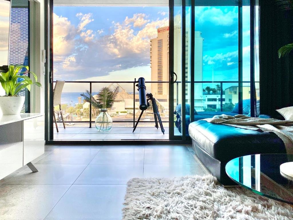 a bedroom with a bed and a view of the ocean at AdriaticBlu Luxe 2 bed apartment with stunning ocean views in Perth