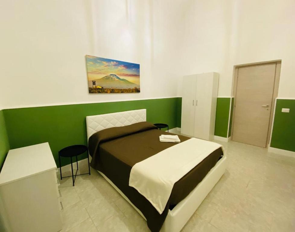 A bed or beds in a room at Il Vicolo Home 2