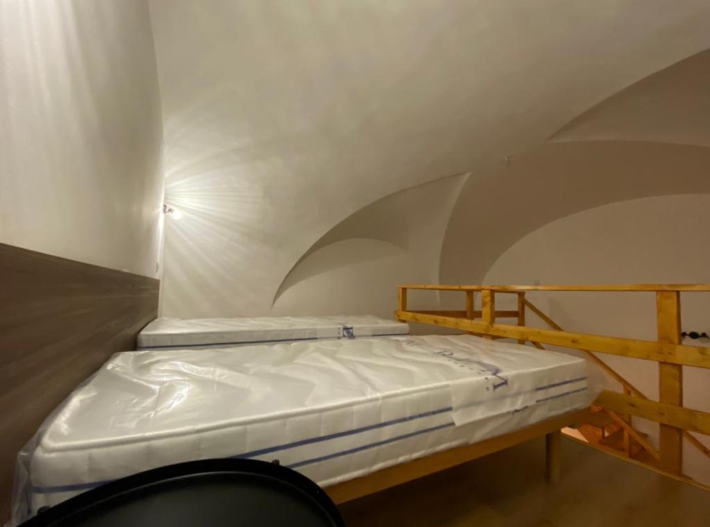 A bed or beds in a room at Il Vicolo Home 2