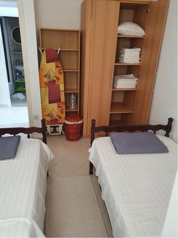 Postel nebo postele na pokoji v ubytování Apartments Elli