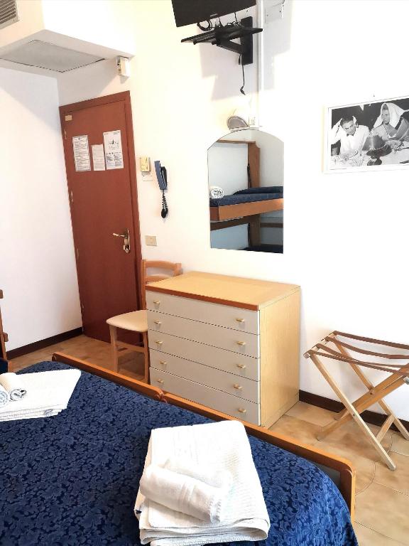 Postel nebo postele na pokoji v ubytování Hotel Alcazar