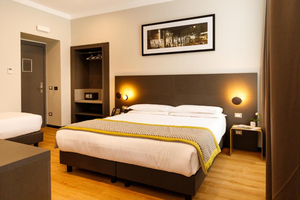 Postel nebo postele na pokoji v ubytování The Cross Hotel