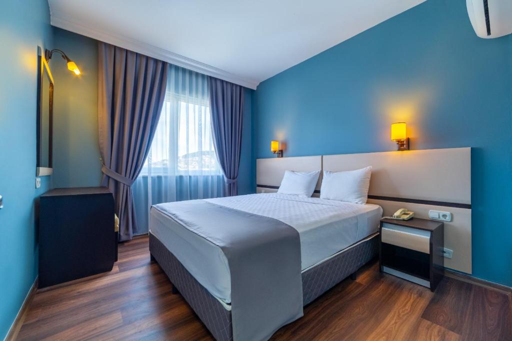 Posteľ alebo postele v izbe v ubytovaní Royalisa City Apart Hotel