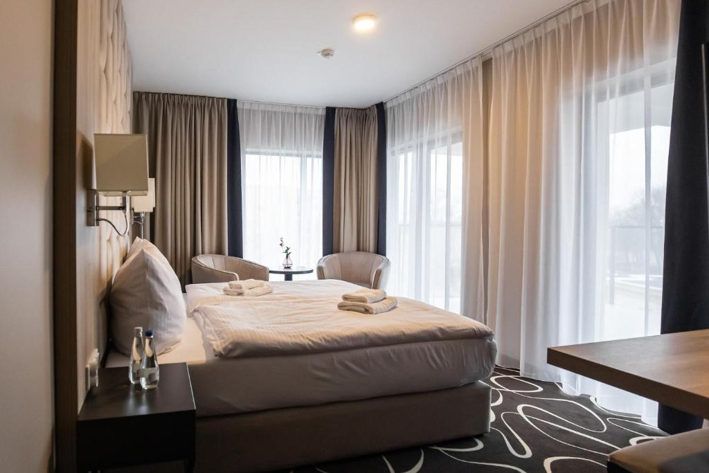 Postel nebo postele na pokoji v ubytování Trofana Wellness & SPA