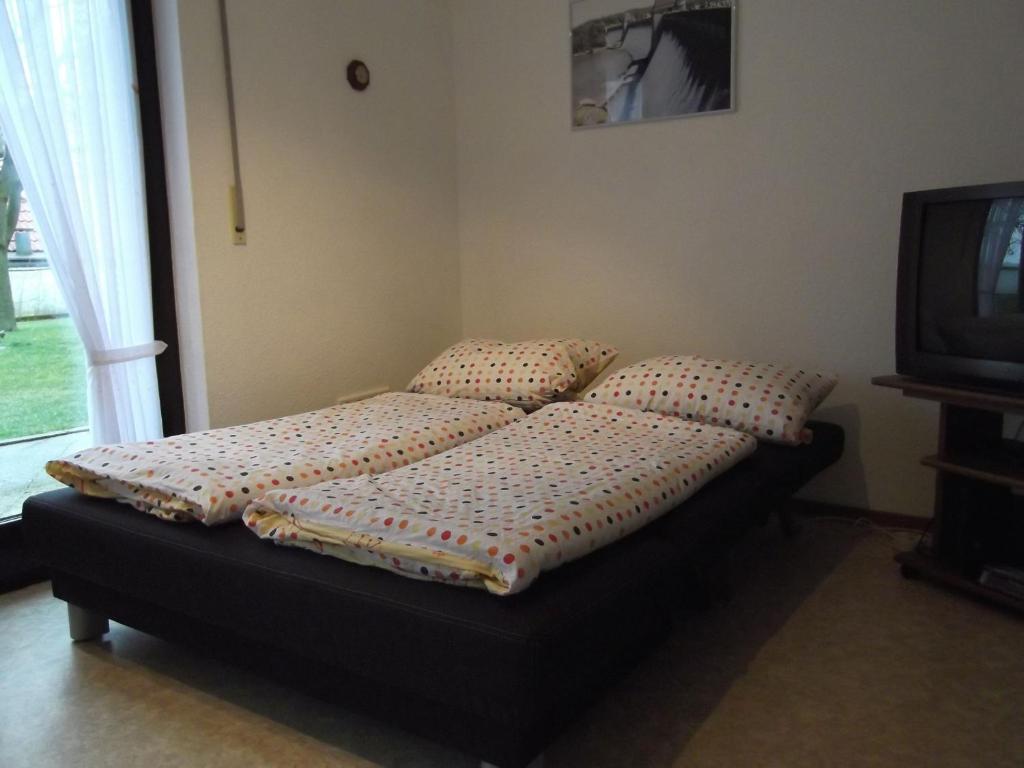 Postel nebo postele na pokoji v ubytování Ferienhaus und Ferienwohnung Knappstein