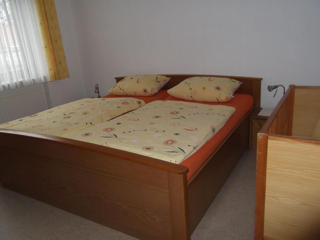 Postel nebo postele na pokoji v ubytování Ferienhaus und Ferienwohnung Knappstein