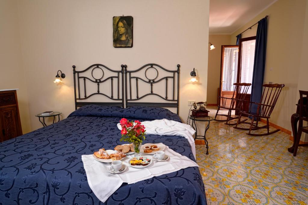 Postel nebo postele na pokoji v ubytování Gattopardo Park Hotel