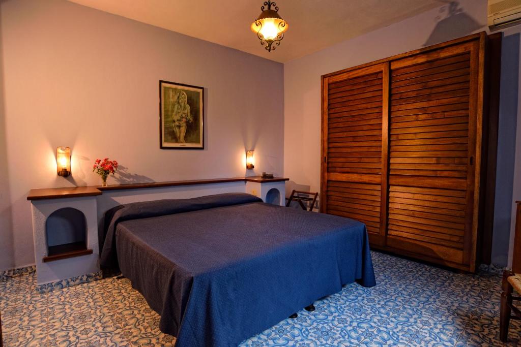 Postel nebo postele na pokoji v ubytování Gattopardo Park Hotel
