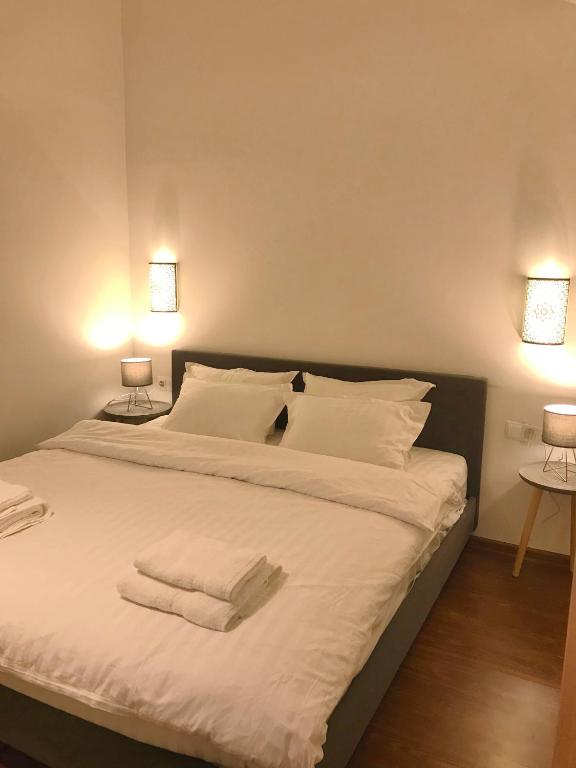 Postel nebo postele na pokoji v ubytování GVC 4-room 421 New Gudauri