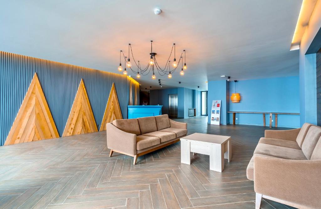 Posezení v ubytování GVC 4-room 421 New Gudauri