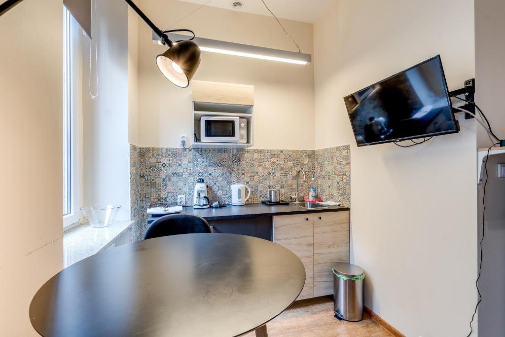 Kuchyň nebo kuchyňský kout v ubytování Mickiewicza Suites