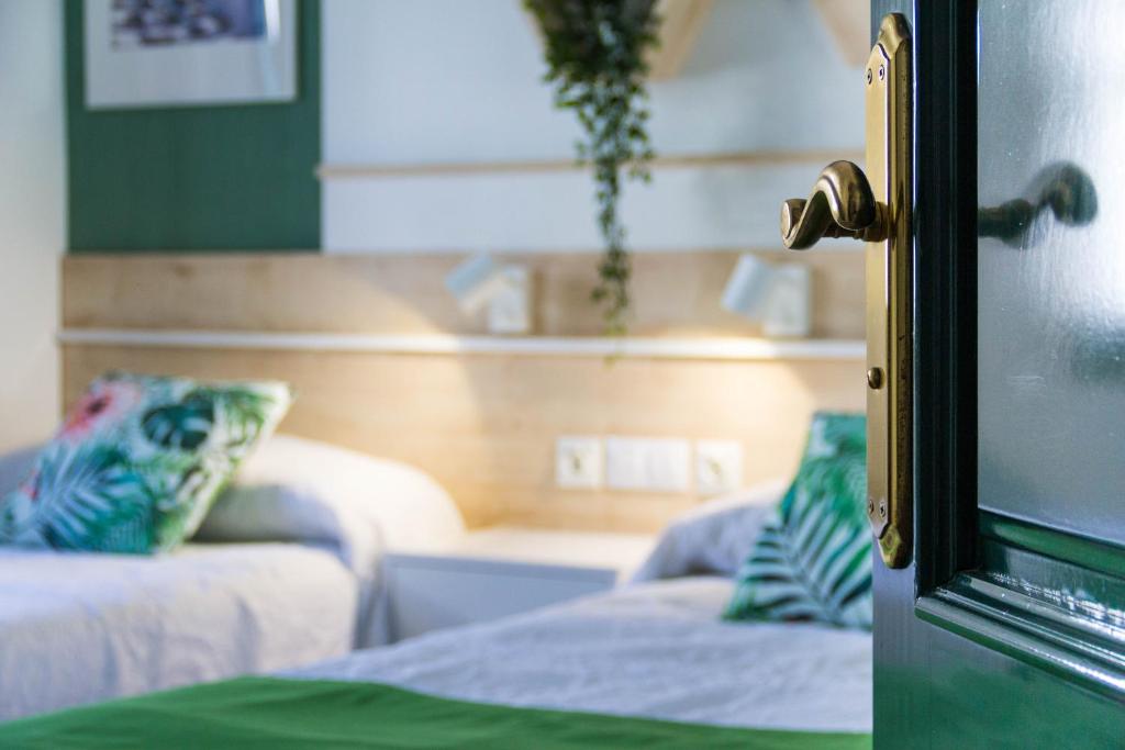 Postel nebo postele na pokoji v ubytování Apartamentos La Tegala