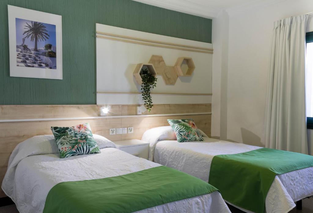 Postel nebo postele na pokoji v ubytování Apartamentos La Tegala