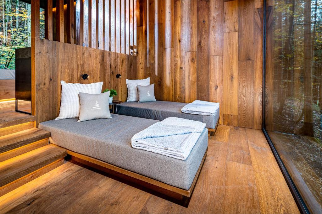 Postel nebo postele na pokoji v ubytování Hotel Fischerwirt Natur WaldSPA