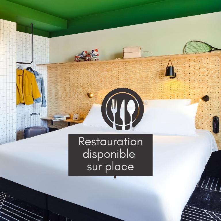Postel nebo postele na pokoji v ubytování ibis Styles Lyon Meyzieu Arena Stadium