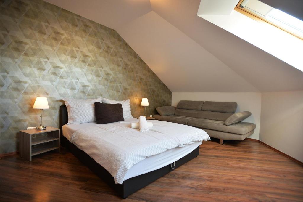 Posteľ alebo postele v izbe v ubytovaní Corner Apartman Eger