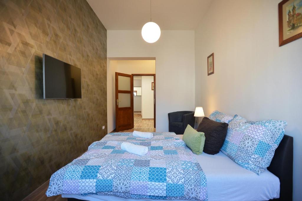 Posteľ alebo postele v izbe v ubytovaní Corner Apartman Eger