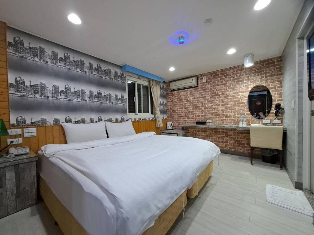 Postel nebo postele na pokoji v ubytování Bin Chen Business Hotel