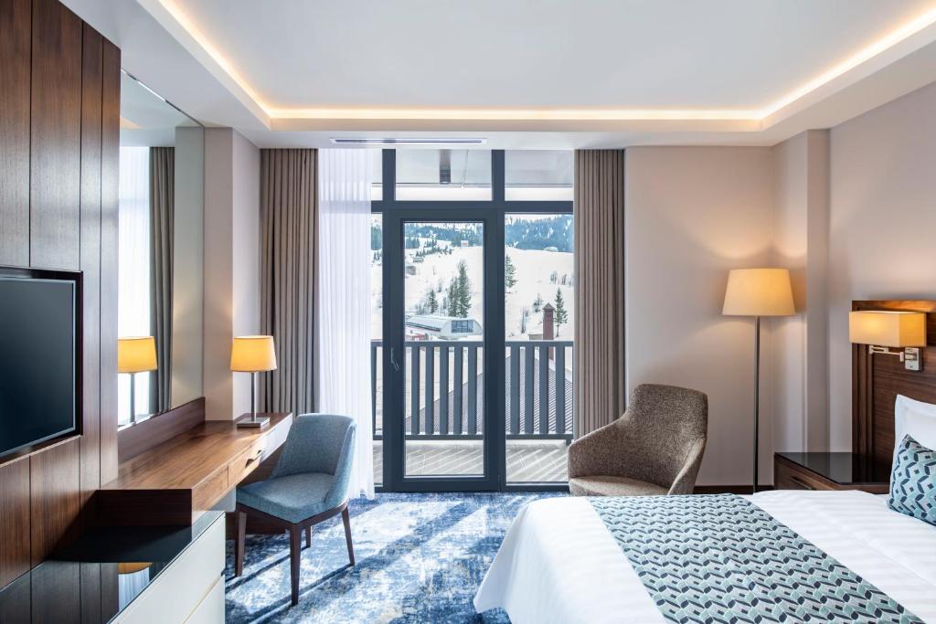 TV a/nebo společenská místnost v ubytování Ambassadori Goderdzi Hotel