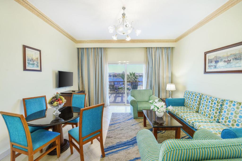 a living room with a couch and chairs and a table at Tolip Aswan Hotel in Aswan