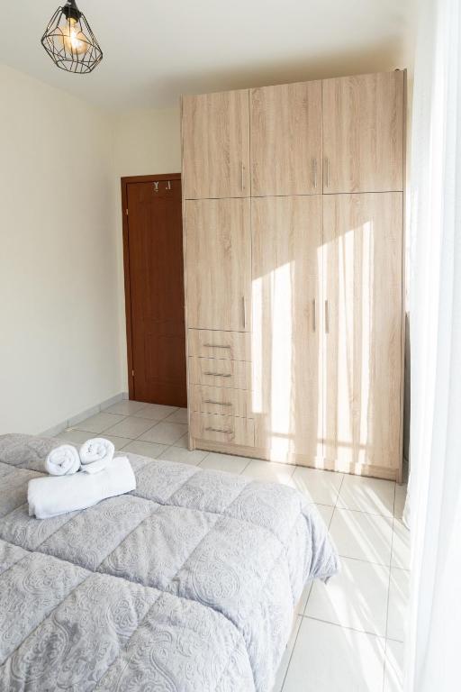 Łóżko lub łóżka w pokoju w obiekcie Yellow Fresh Apartment 2