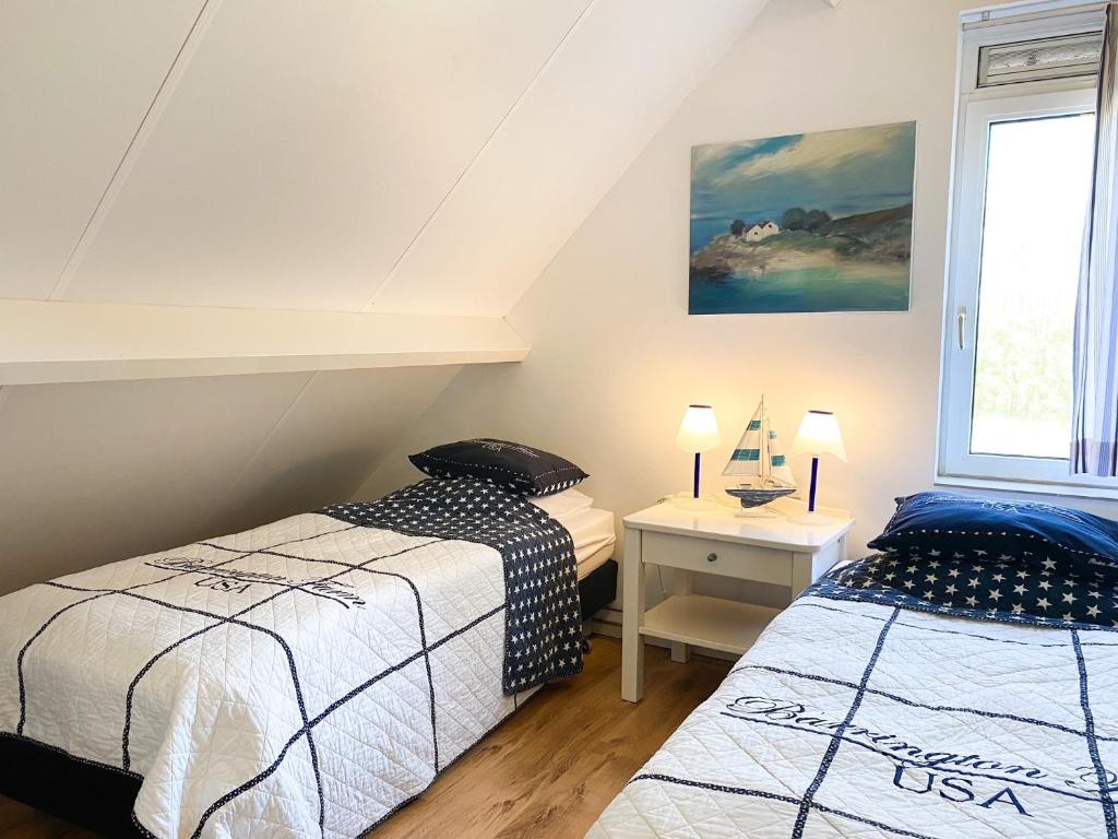 Postel nebo postele na pokoji v ubytování Luxe Vakantiehuis Oostkapelle OK32