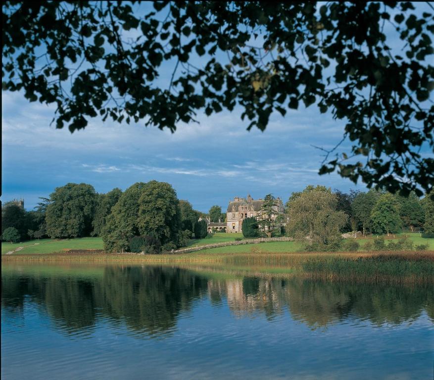 a large body of water surrounded by trees at The Lodge at Castle Leslie Estate in Glaslough