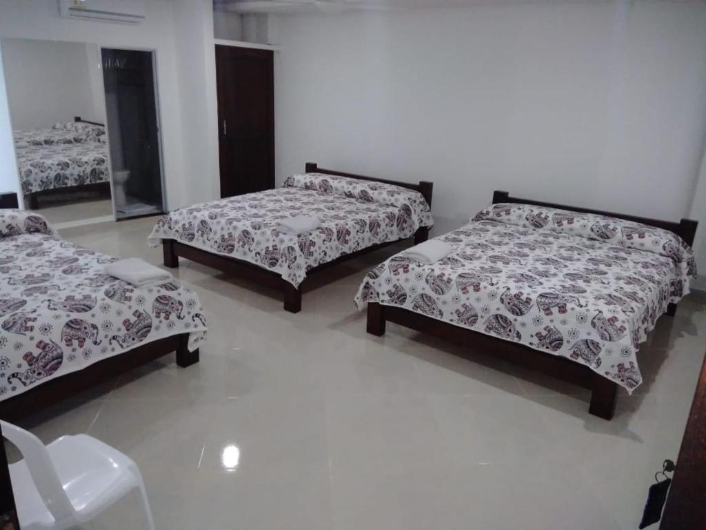 Postel nebo postele na pokoji v ubytování HOTEL TANIA