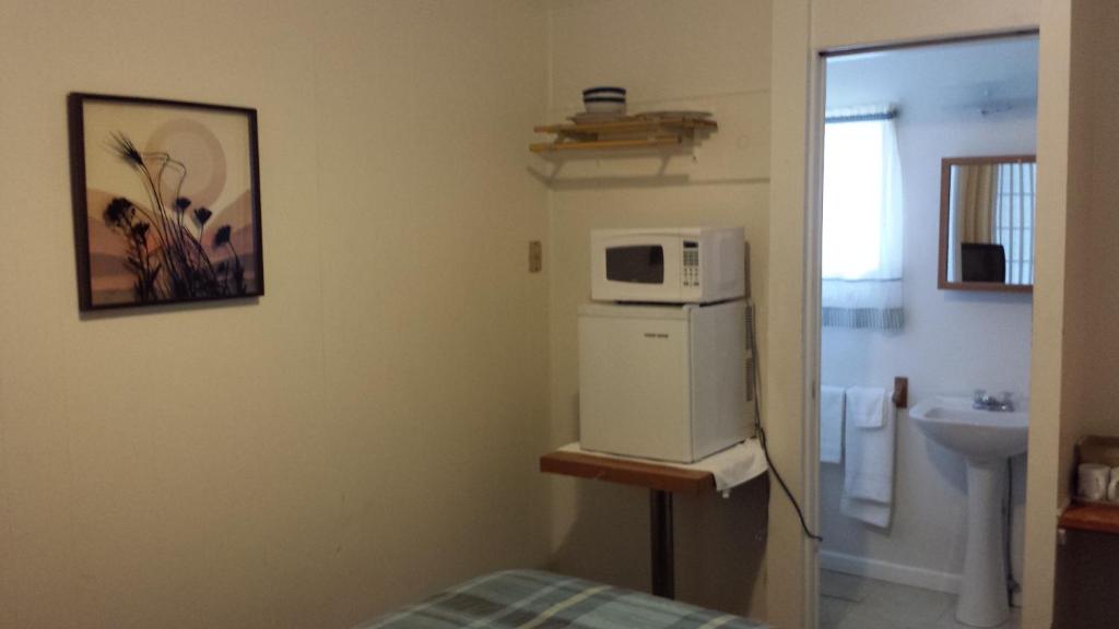 Kuchyň nebo kuchyňský kout v ubytování Relax Inn