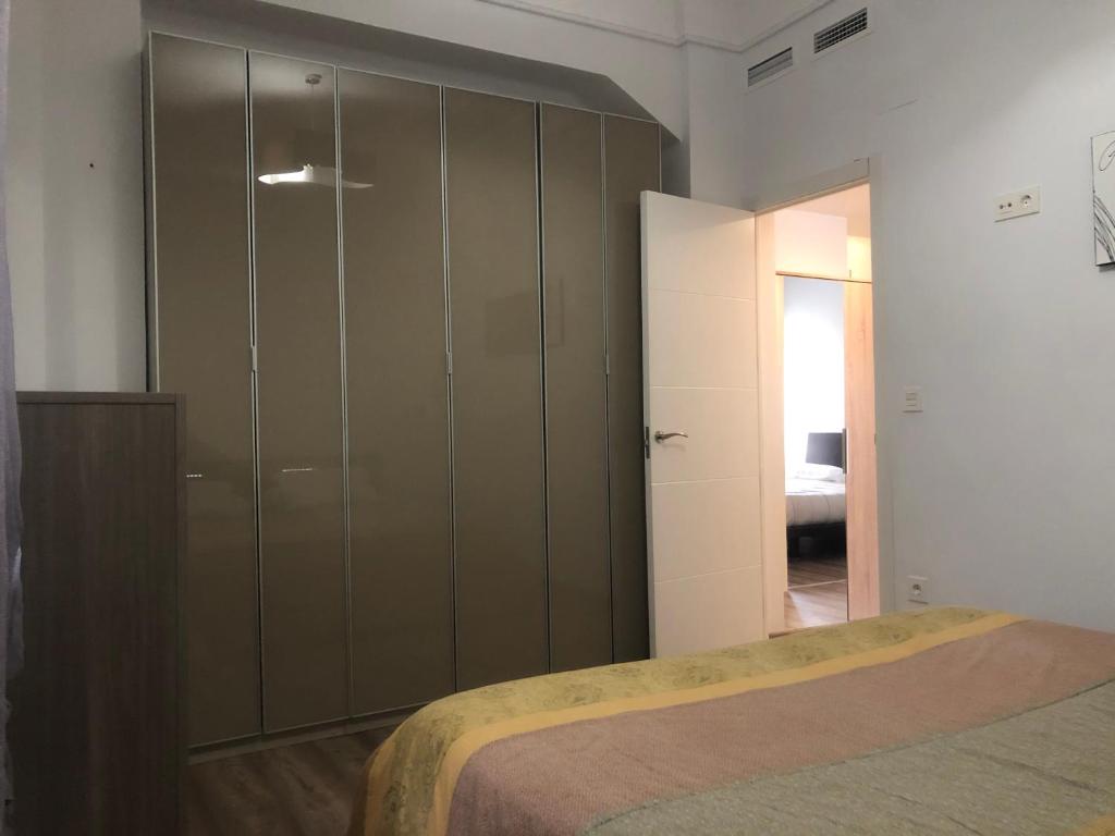 Postel nebo postele na pokoji v ubytování Enjoy Valencia