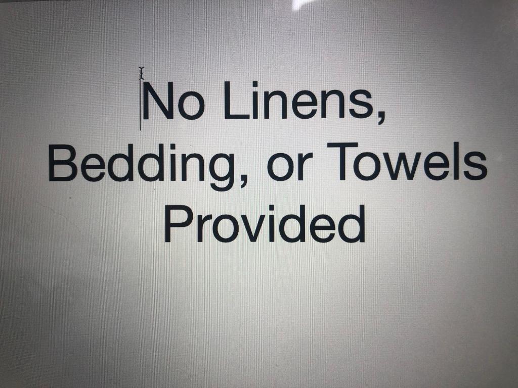 a sign that reads no linens bedding or towels provided at Tillamook Bay City RV Park in Tillamook