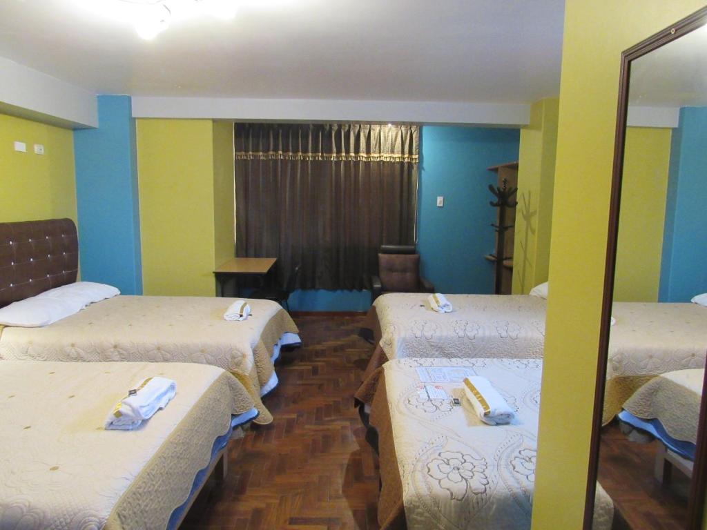Postel nebo postele na pokoji v ubytování Hotel Sueños Dorados