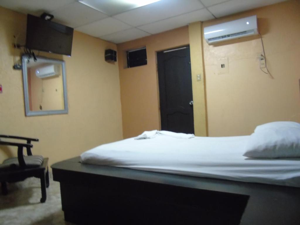 Postel nebo postele na pokoji v ubytování Hotel Imperial