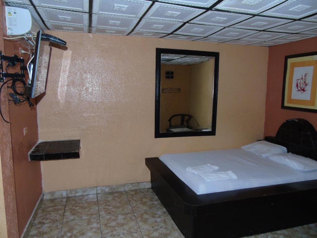 Postel nebo postele na pokoji v ubytování Hotel Imperial
