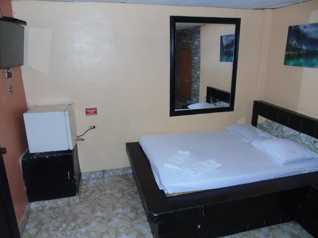 Postel nebo postele na pokoji v ubytování Hotel Imperial